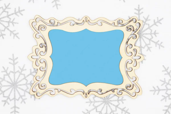 Blank wood frame with white and gray snowflake background — Stock Photo, Image