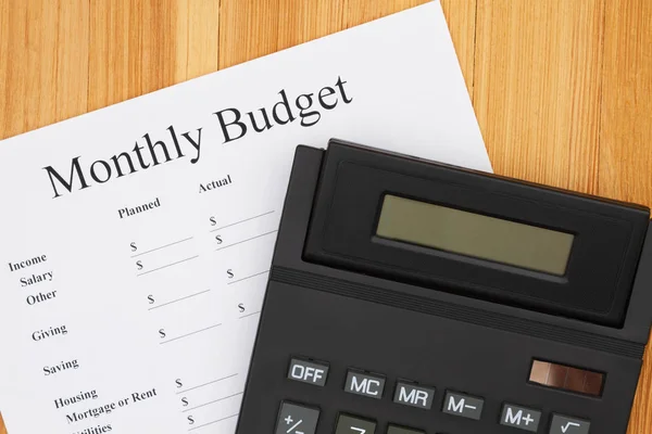 Creating your monthly budget with a calculator — 스톡 사진
