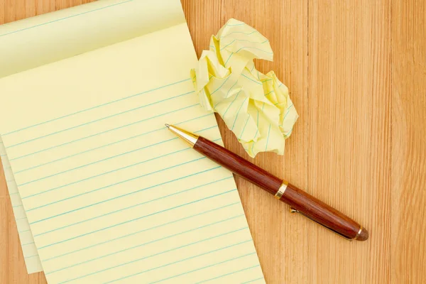 Yellow Legal Notepad Paper Crumpled Paper Pen Wood Desk Copy — Stock Photo, Image