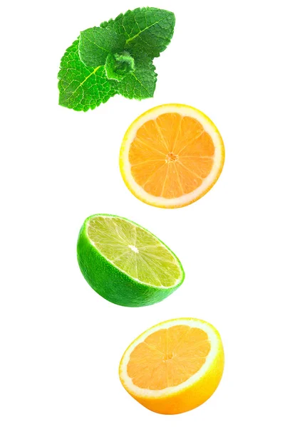 Falling pieces of mint, lemon and lime isolated on white — Stock Photo, Image