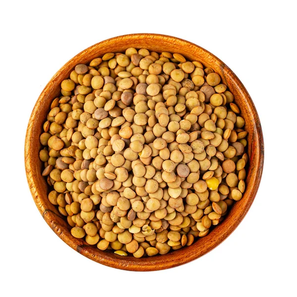 Pilha com grãos de lentilha em um fundo branco — Fotografia de Stock