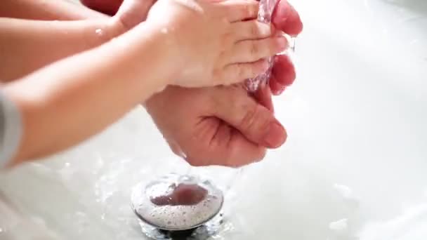 Father Helps Wash His Little Son Hands Soap Faucet Close — Stock Video
