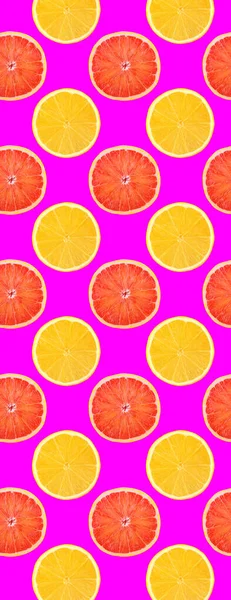 Creative seamless pattern food. Fresh slice of orange and lime fruits on green background. Full depth of field.