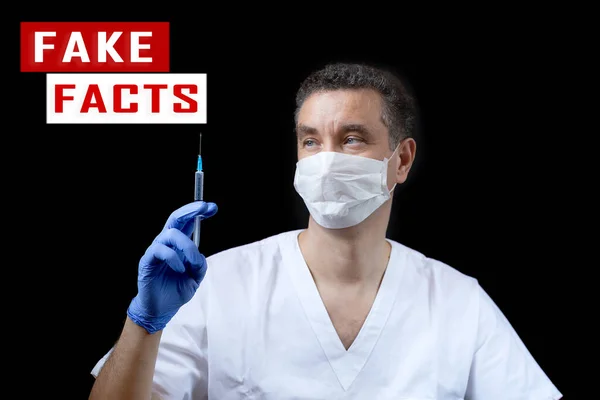 Corona virus fake news concept. Man wearing protective mask and blue latex gloves. Doctor holding syringe with vaccine in hand and explaining to child. Social media disinformation. Banner with copy space.