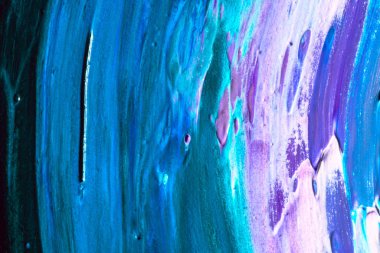 Dökülen boyanın soyut renkli arkaplanı yakın plan