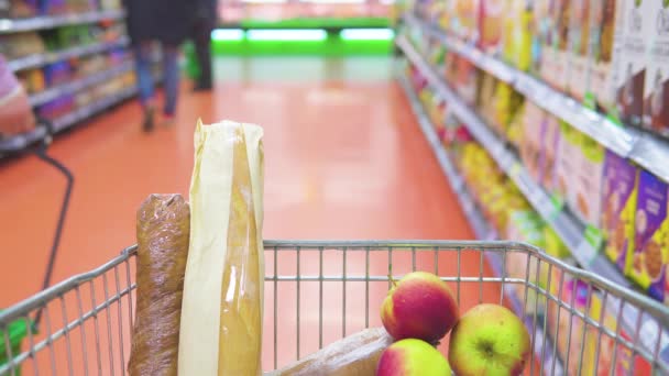 Metal Food Trolley Moves Stands Supermarket Shelves Goods — Stock Video