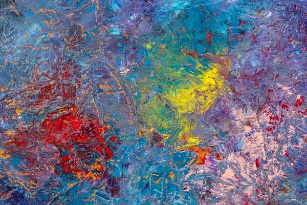 Abstract background of multi-colored stains of oil paint.