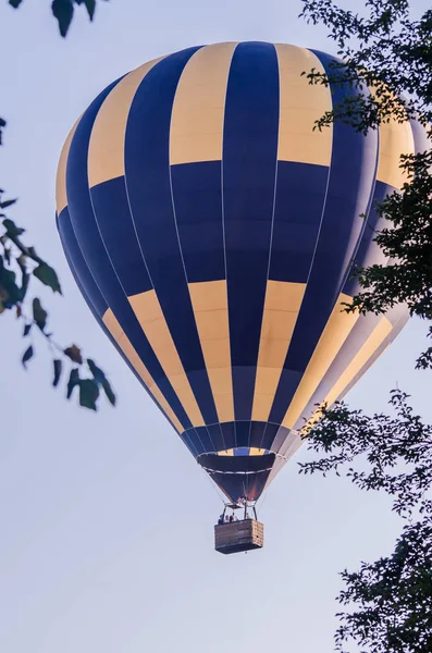 Hot air balloon is flying at sunrise. romantic balloon flights — 스톡 사진