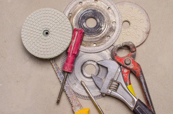 Construction equipment on concrete background. Closeup. Tool for work — Stock Photo, Image