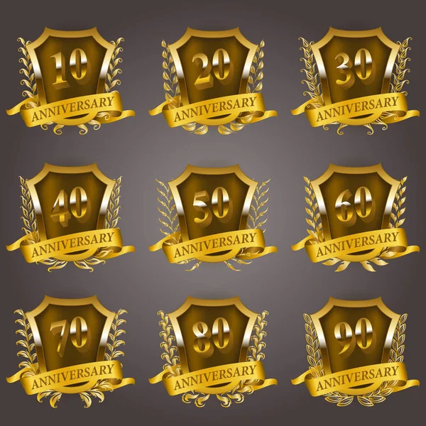 Set de insignias de aniversario de oro — Vector de stock