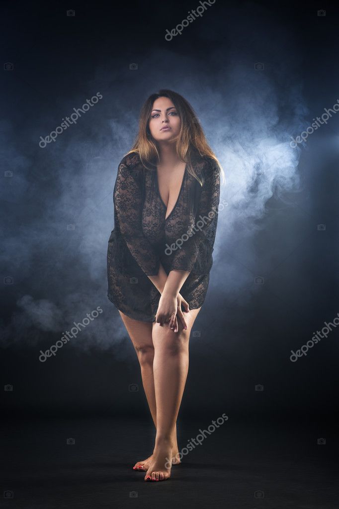 Young naked beautiful caucasian plus size model, xxl woman in black  peignoir on smoky background, beauty female nude body with big breast Stock  Photo by Â©starast 124960804