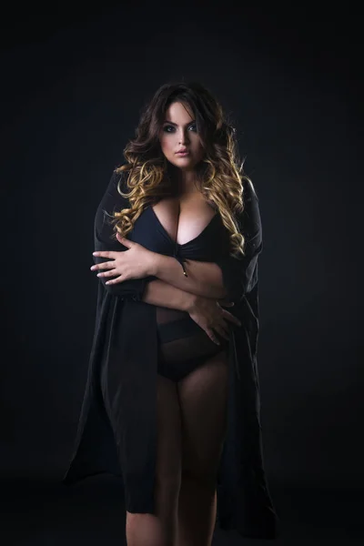 Young beautiful plus size model in underwear, xxl woman on black background — Stock Photo, Image