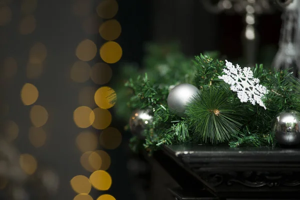 Shiny Christmas white ball hanging on pine branches with festive background close-up — Stock Photo, Image