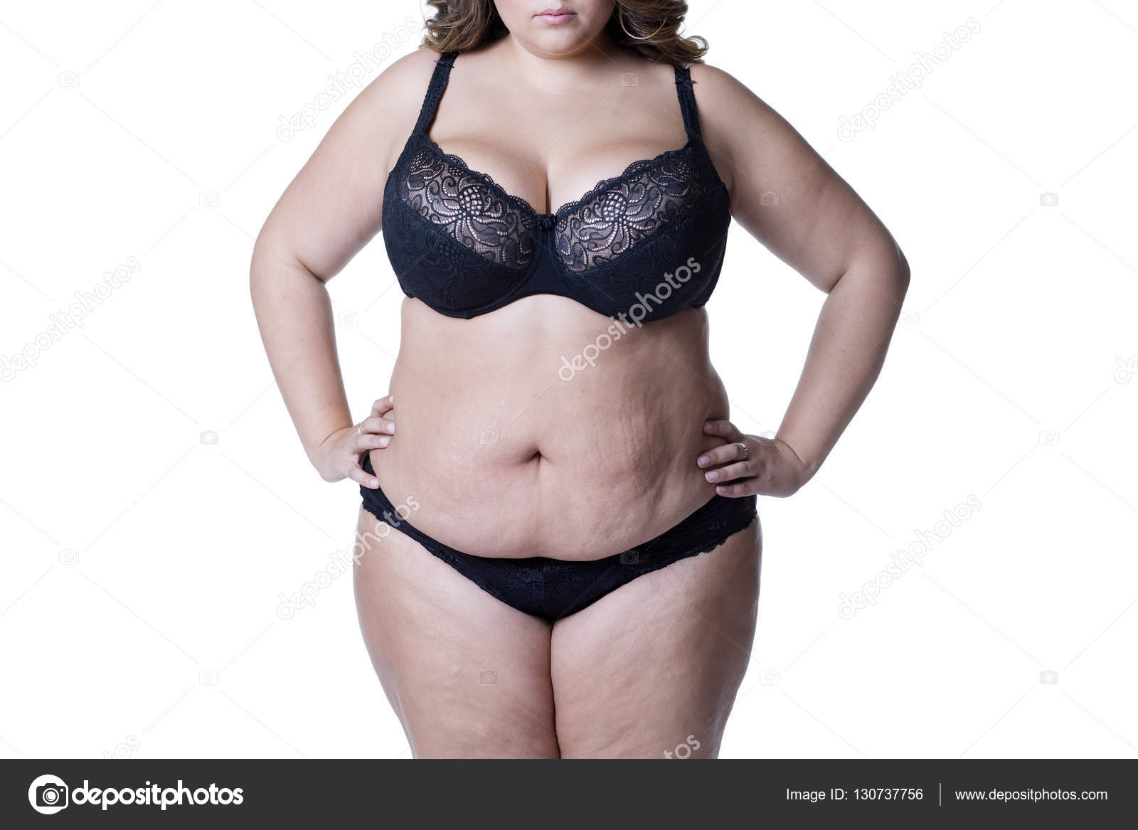 Plus size model in black lingerie, overweight female body, fat woman with  stretch marks isolated on white background Stock Photo by ©starast 130737756