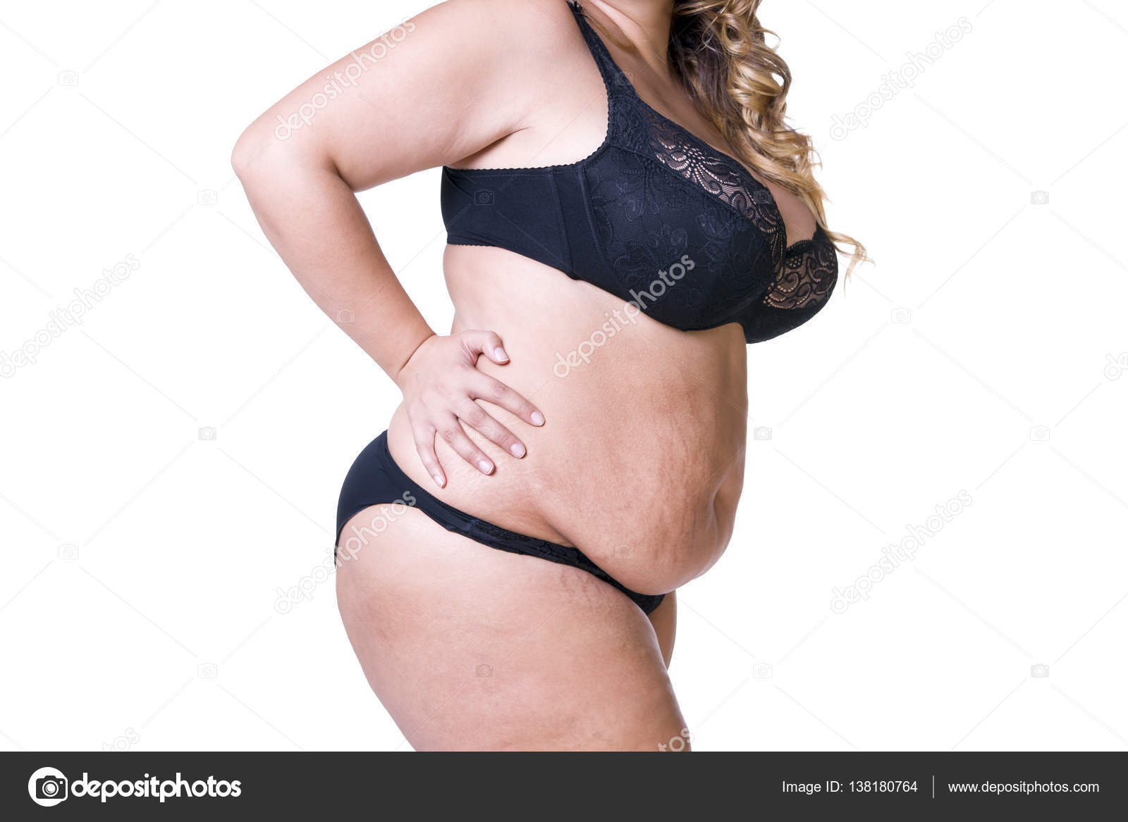 Plus size model in black lingerie, overweight female body, fat woman with  flabby stomach isolated on white background Stock Photo by ©starast  138180764