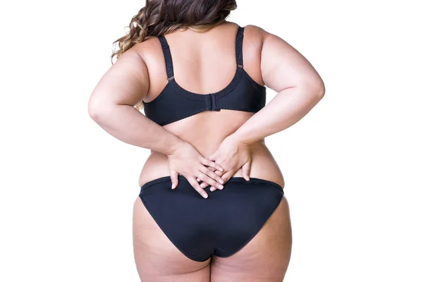 Plus size model in zwarte lingerie, overgewicht vrouwelijk lichaam, dikke vrouw met cellulitis op de dijen, geïsoleerd op witte achtergrond — Stockfoto