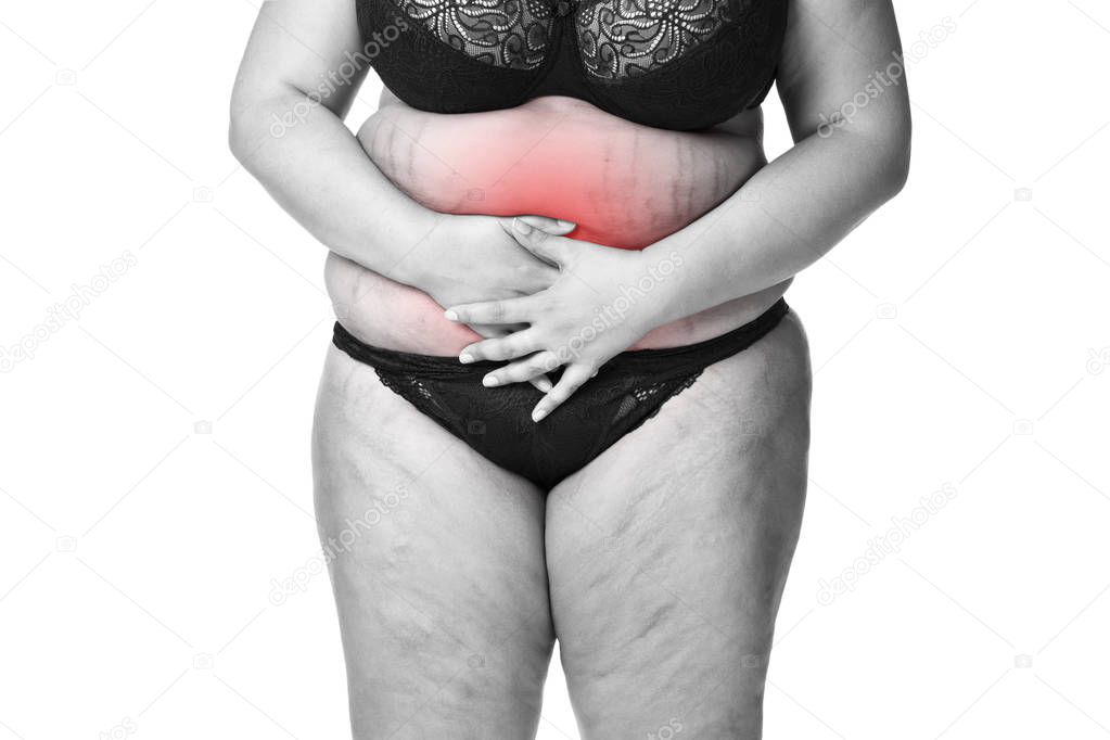 Fat woman with menstrual pain, endometriosis or cystitis, stomach ache, overweight female body isolated on white background
