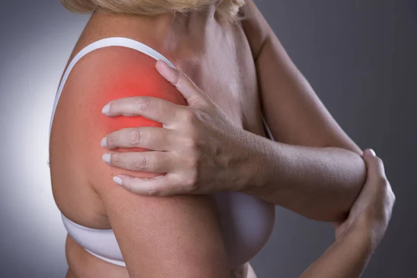 Pain in shoulder, care of female hands, ache in woman's body — Stock Photo, Image