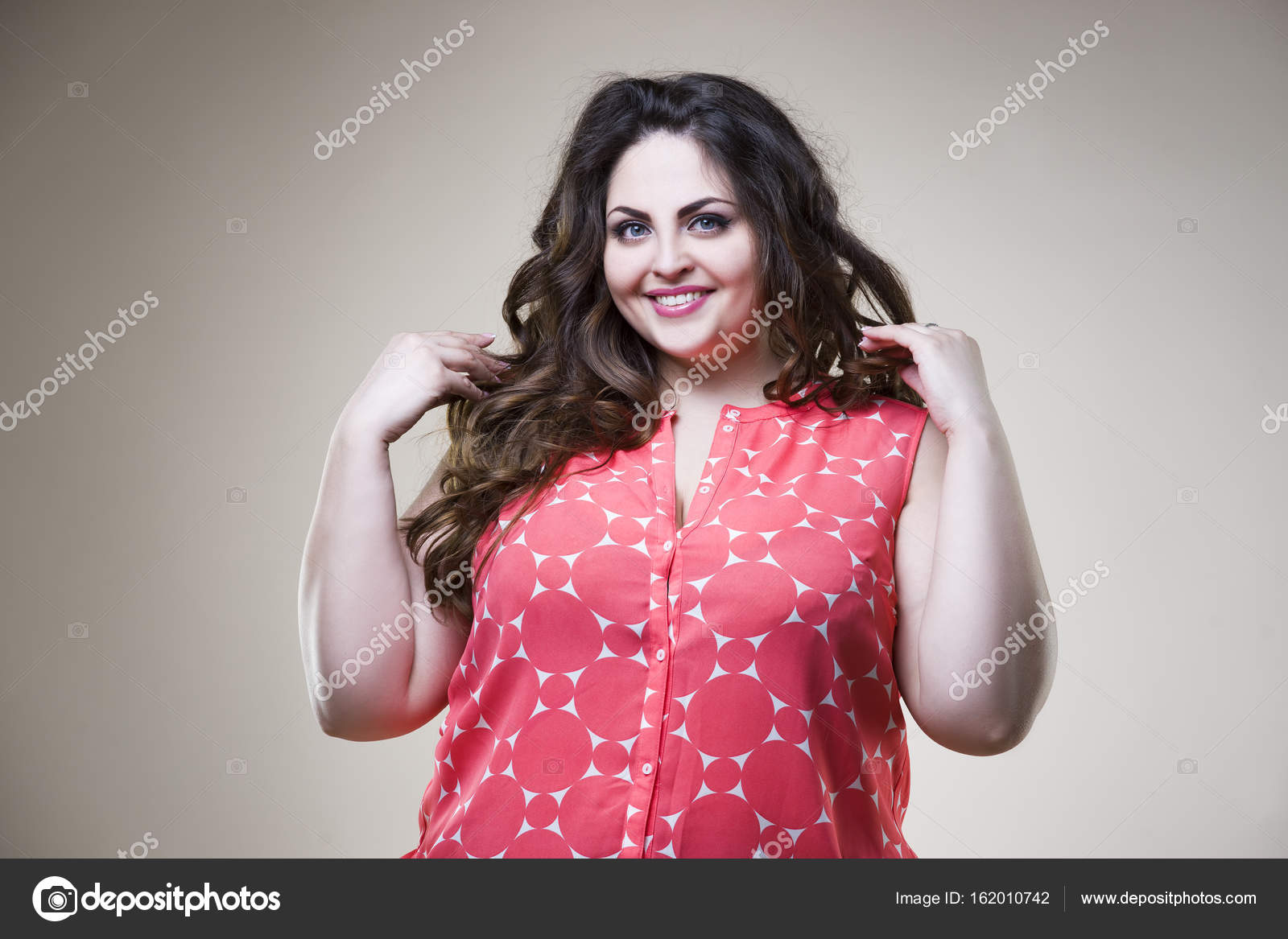 Happy plus size fashion model in casual clothes, fat woman on beige ...