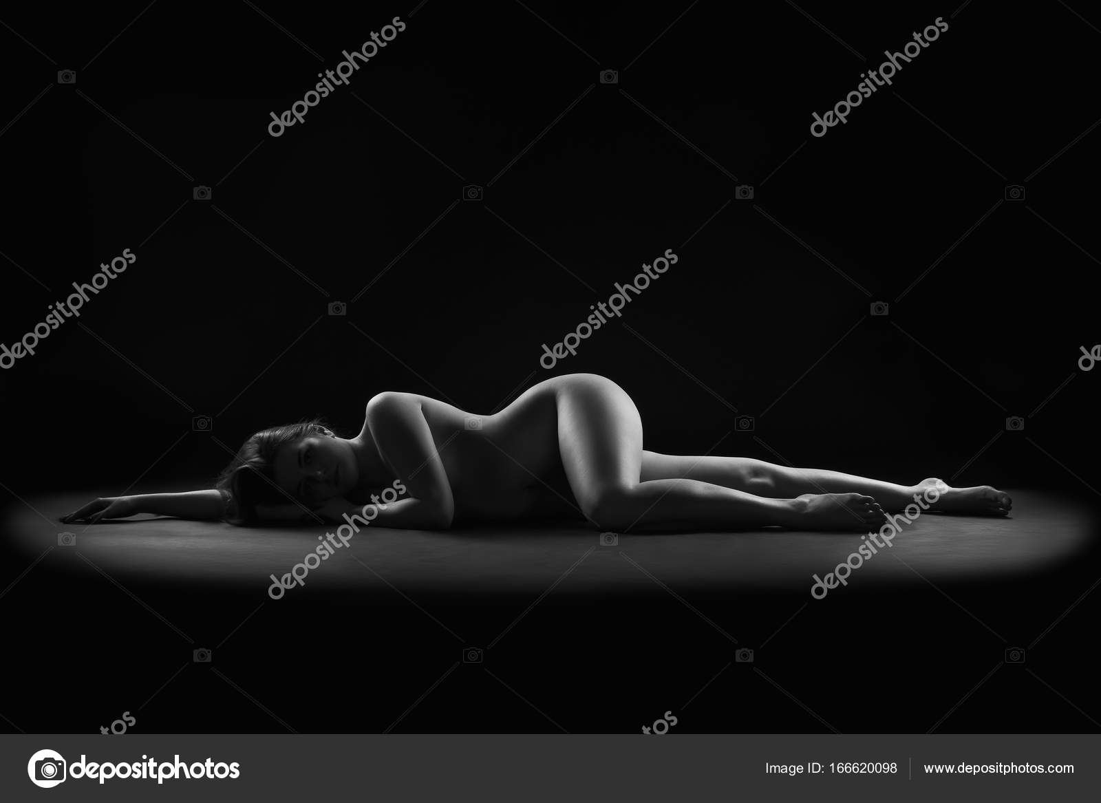 Art nude, perfect naked body, sexy woman on dark background Stock Photo by  Â©starast 166620098