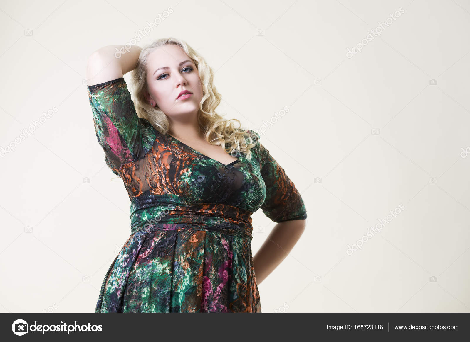 Plus size fashion model, fat woman on beige background, overweight
