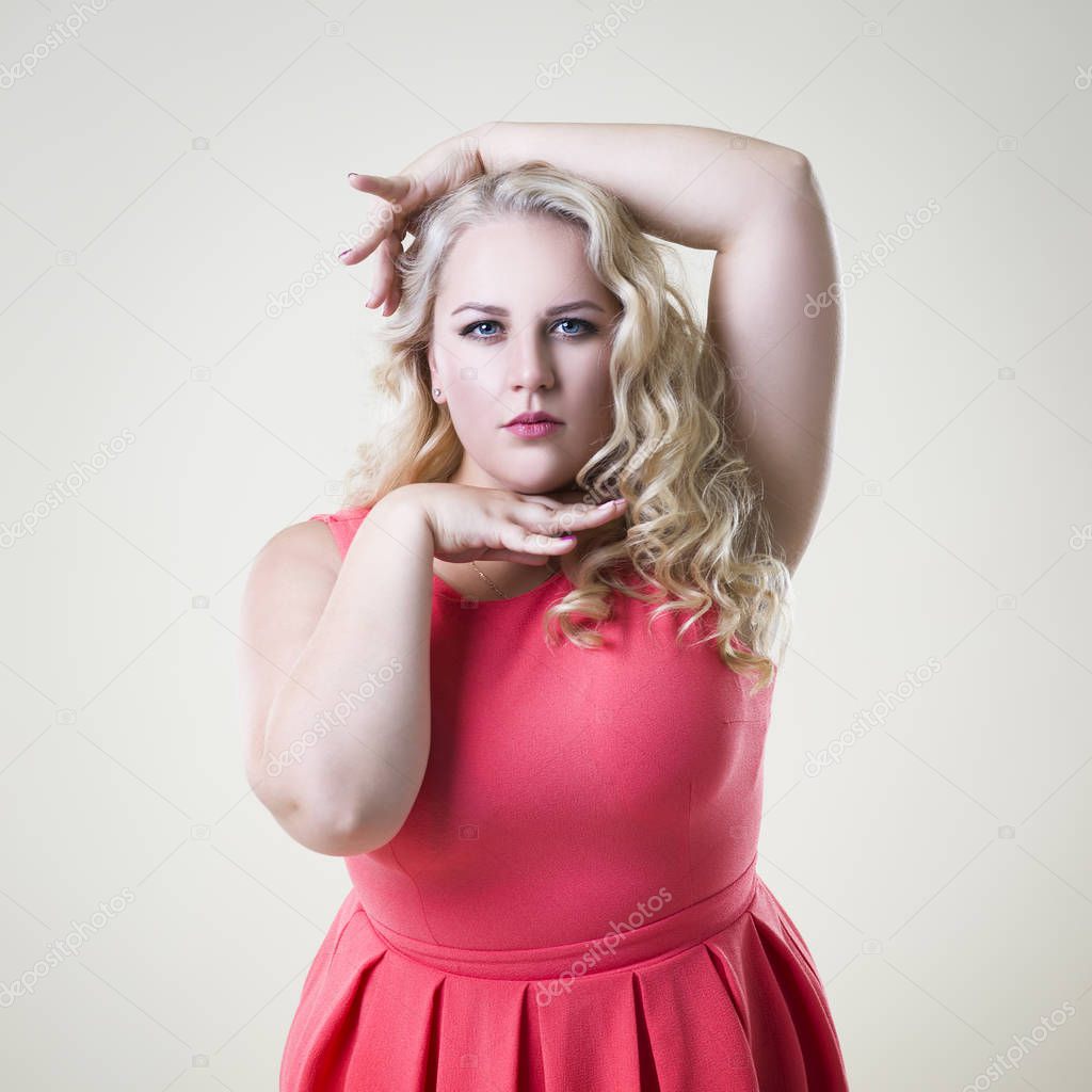 Plus size fashion model, fat woman on beige background, overweight female body