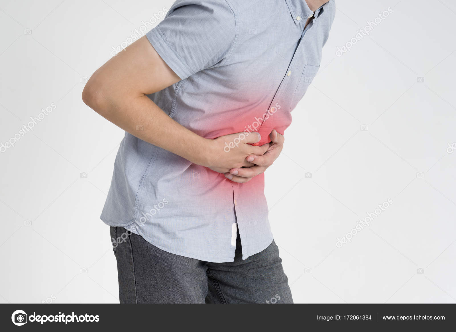 Man with abdominal pain, stomach ache on gray background — Stock Photo © starast 172061384