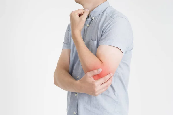 Pain in elbow, joint inflammation with red dot on gray background — Stock Photo, Image