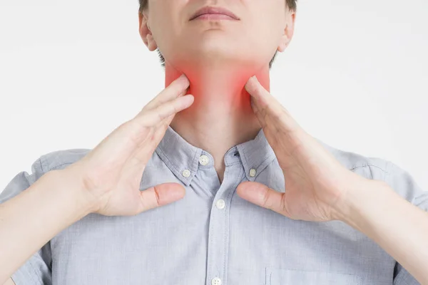 Sore throat, men with pain in neck, gray background — Stock Photo, Image