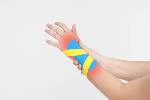 Kinesio tape, kinesiology taping on human hand