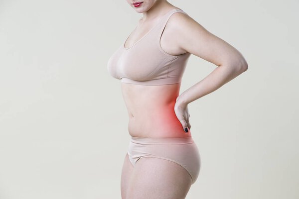 Back pain, kidney inflammation, ache in woman's body
