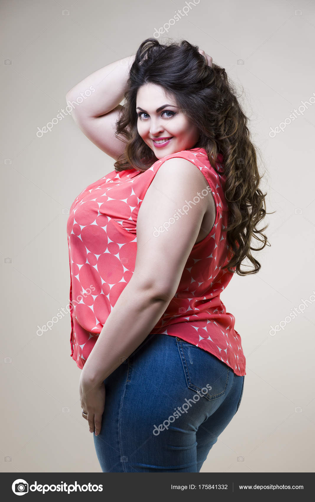 Happy plus size fashion model, sexy fat woman on beige background