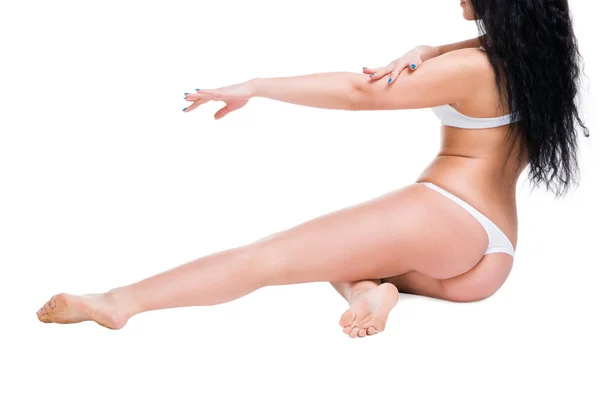 Kvinna i underkläder på vita studio bakgrund, celluliter på kvinnokroppen — Stockfoto
