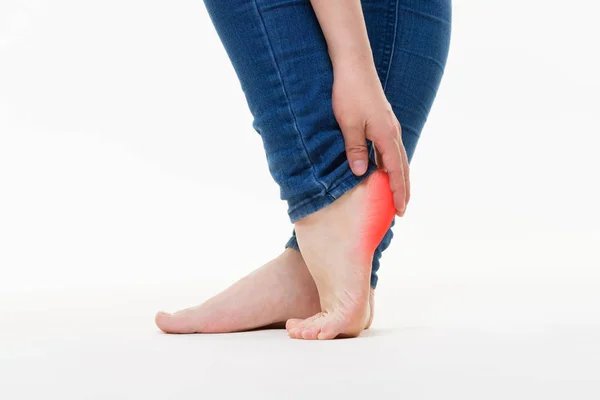 Pain in woman's legs, massage of female feet on white background — Stock Photo, Image