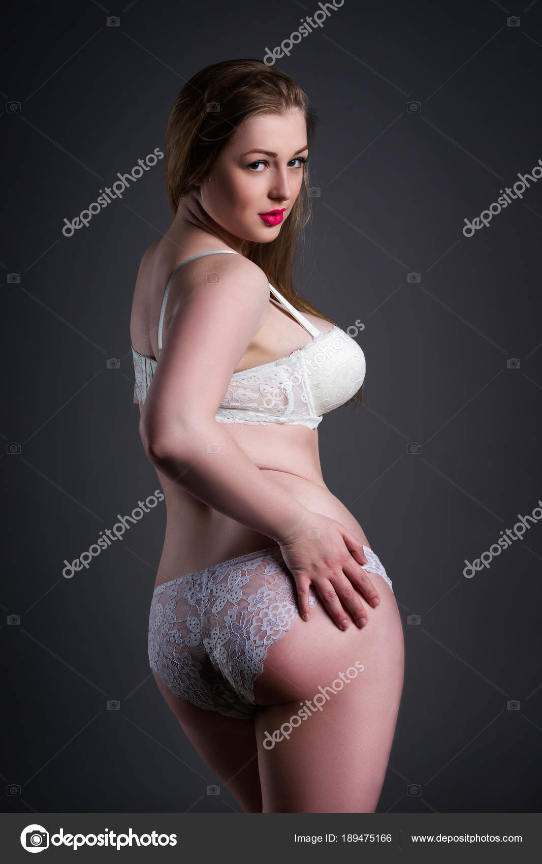 Plus size sexy model in white underwear, fat woman with big natural breast on gray studio background, overweight female body Stock Photo by ©starast 189475166