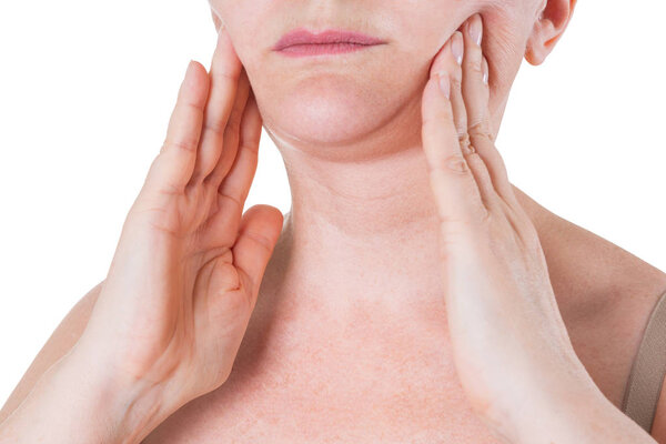 Flabby skin on the neck of an elderly woman isolated on white background