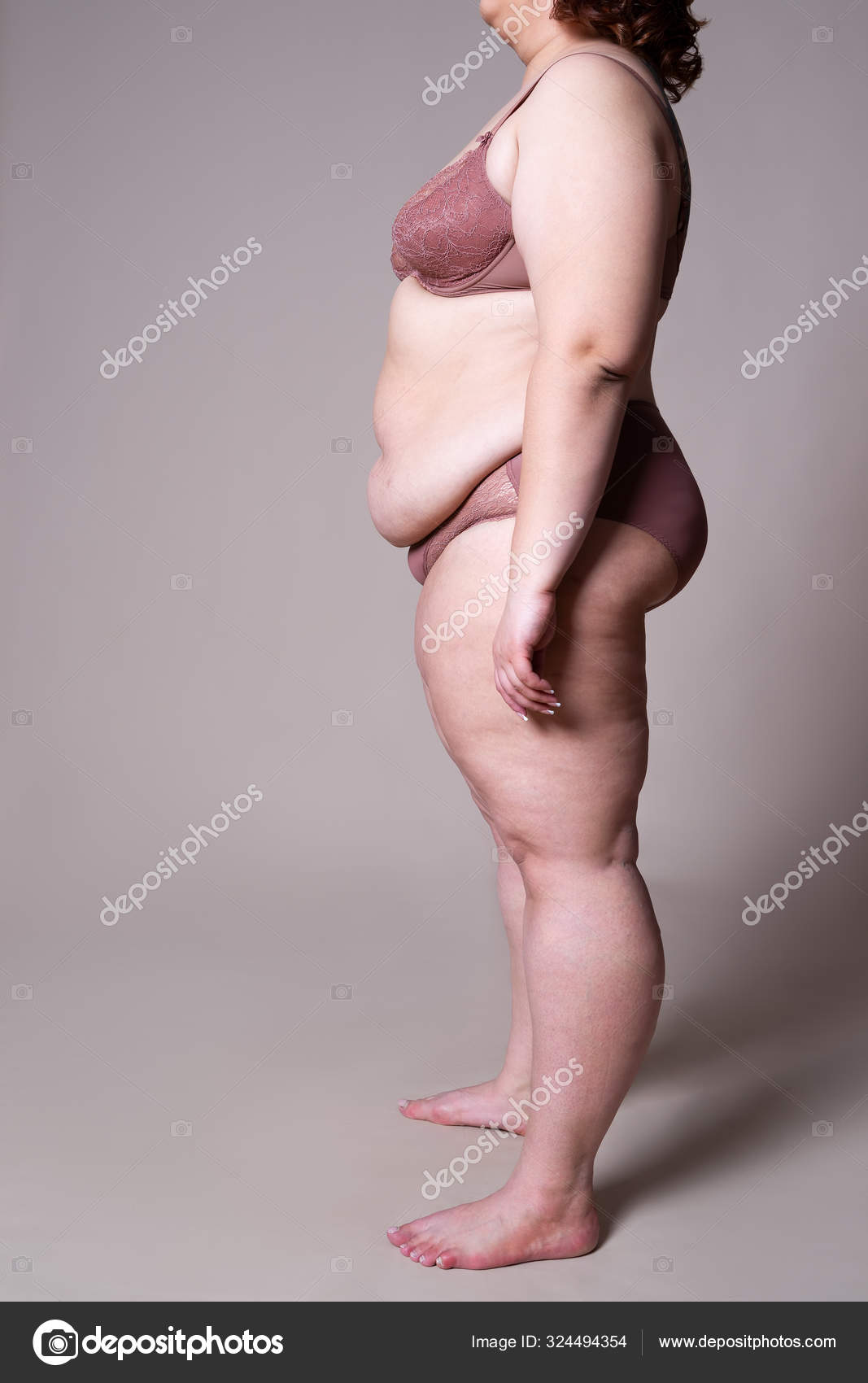Premium Photo  Cropped photo of overweight woman in underwear