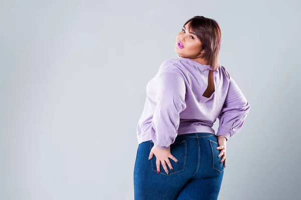 stock image Plus size fashion model in casual clothes, fat woman on gray background, body positive concept