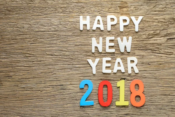 Happy new year 2018 words on wooden background