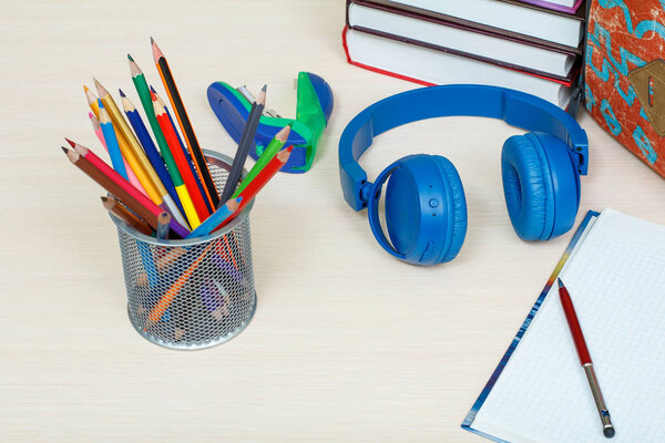 School supplies. School backpack, books, metal stand for pencils