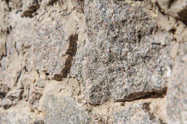 Fragmento de muro de piedra gris. Vista lateral — Foto de Stock