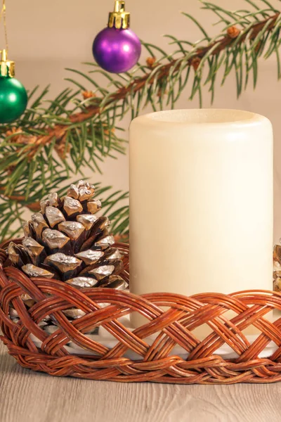 Cone, candle and natural fir tree branches with Christmas orname — Stock Photo, Image