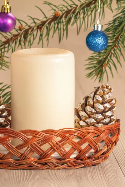Cone, candle and natural fir tree branches with Christmas orname — Stock Photo, Image
