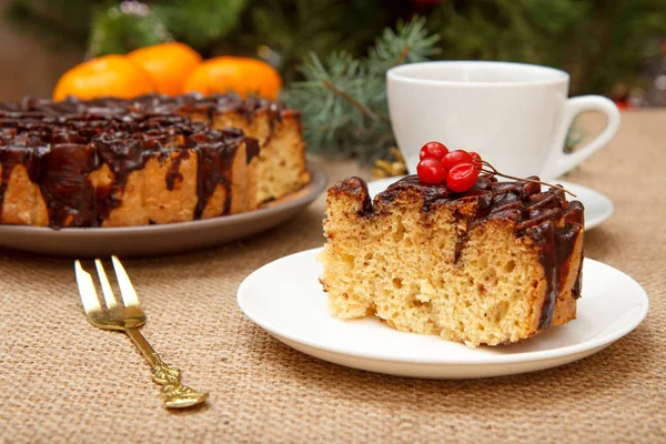 Chocolate cake decorated with bunch of viburnum and cup of coffee. — 스톡 사진