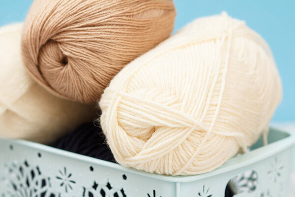 Woolen yarn for knitting. Balls of natural wool yarn.