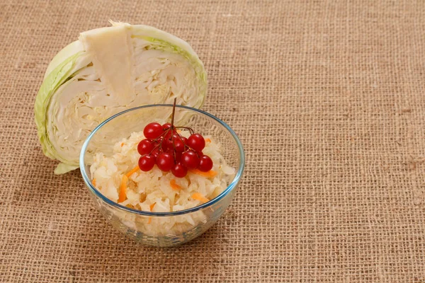 Fermented cabbage with herbs and spices in glass bowl on sackcloth. — 스톡 사진