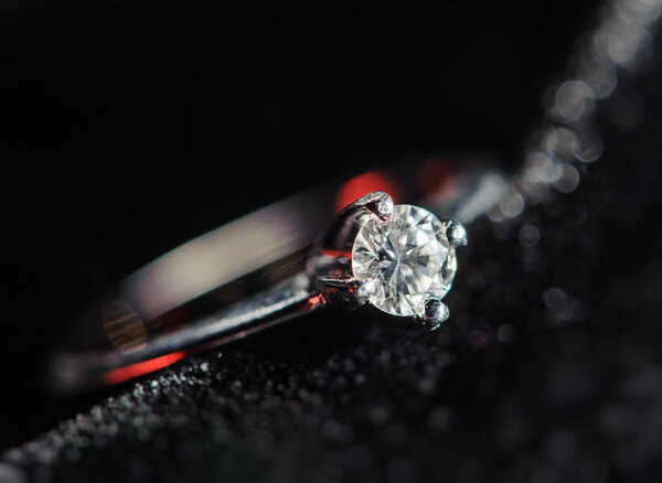 diamond ring on a black background