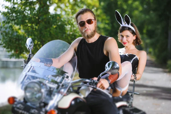 Portrait of sexy couple of bikers on the motorcycle