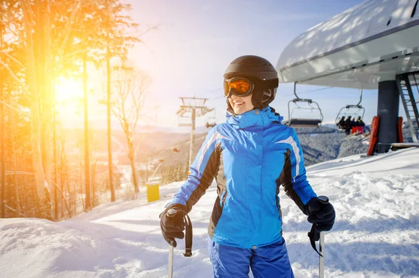 Female skier on the top of ski slope with ski-lift — Stock Photo, Image