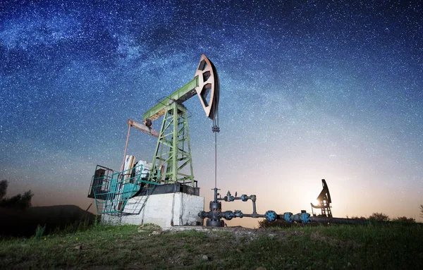 Oil pump on the oil field in the night